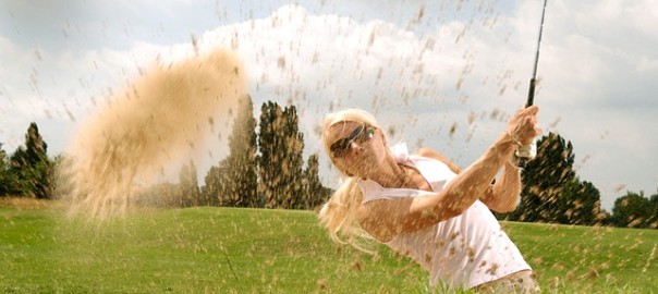 A woman playing golf